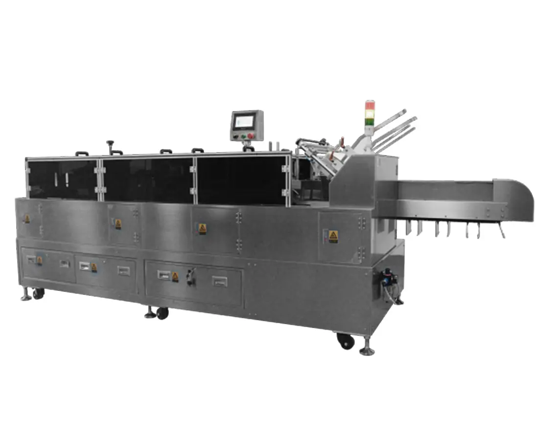 Retail cartoning machine for inserting grouped pharmaceutical packs into folding paperboard cartons