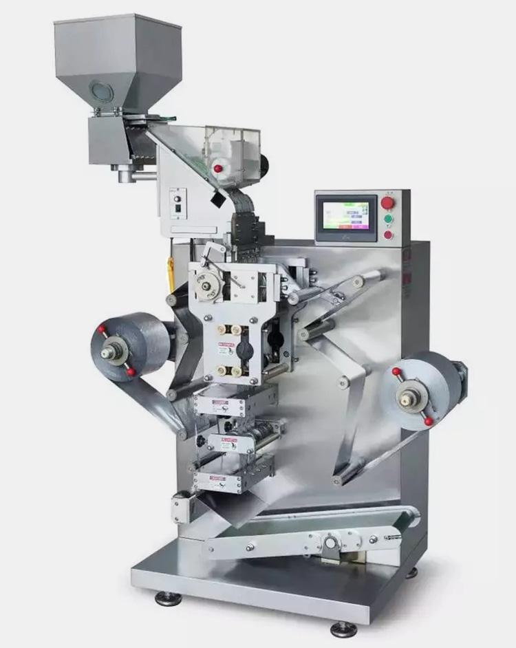 Tablet strip packing machine with a product hopper, two packaging-web rolls and a central sealing and cutting section